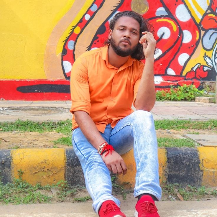 Kaveri Mehta, Lead Design Curator at Tidy Circuit Remote, reviewing corporate floral arrangements